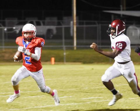 Sam Franklin (2) is shown eluding the grasp of a Pickens County defender.