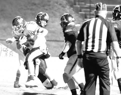 Hubbertville’s Tanner Upton (25) is shown running for a touchdown against Hackleburg.