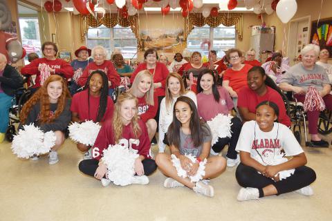 Shown are the fans and cheerleaders representing Alabama at the pep rally.