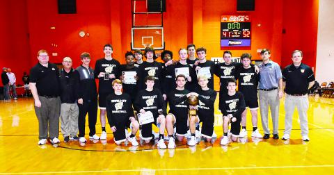 The Winfield Pirates’ boys basketball team is pictured posing with the championship trophy won at the WAC Basketball Tournament in Fayette.