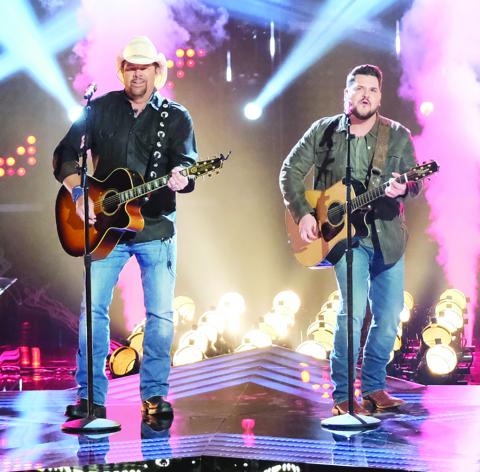 Country music singer Toby Keith (left) is shown performing with Dexter Roberts on the results show finale of NBC’s “The Voice.” Roberts was one of the final four contestants on the show and finished in third place.