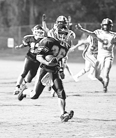 Gage Key (36) is pictured scoring a touchdown for Hubbertville.