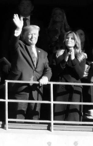 Shown are President Donald Trump and First Lady Melania Trump at the Alabama - LSU football game.