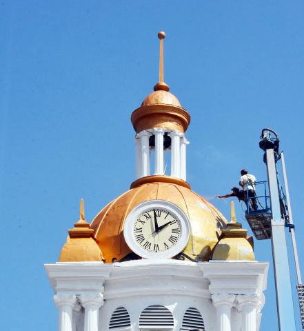 Two local painters are shown giving the courthouse dome a fresh coat of paint on Wednesday, Sept. 9. 