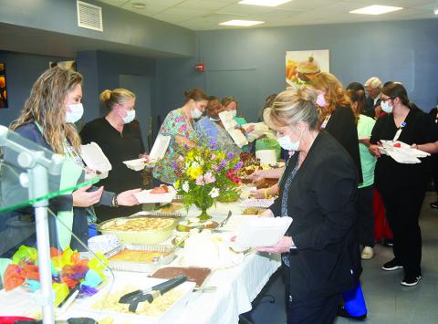 Pictured are a few of the Fayette Medical Center and Fayette Medical Center Long-Term Care workers as they enjoyed the food provided for them.