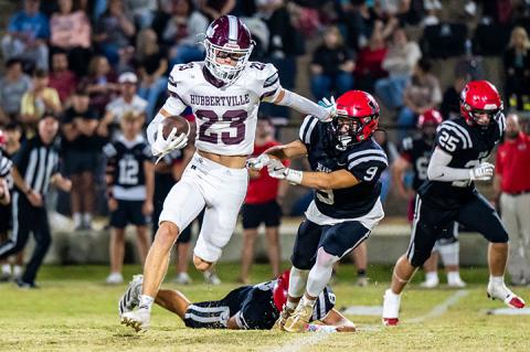 Hub’s Kane Rushing (23) evades the grasp of a Bears’ defensive player. | Photo by Leah Hollingsworth