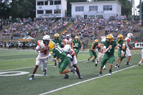 Zamarion Nalls drives it into the endzone in the first quarter of the Tigers’ matchup against the Gordo Green Wave on Aug. 21 at Libby Hankins Stadium in Gordo. 