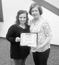 Gracie Bonds, student at the University of Alabama (left), is shown receiving the Alpha Xi Fayette Chapter of Delta Kappa Gamma’s Scholarship Grant-in-Aid from Frances Butler, Alpha Xi Treasurer. 