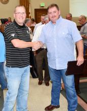 Fayette Police Chief Danny Jenkins (left) congratulates Byron Yerby after the results for sheriff were announced.