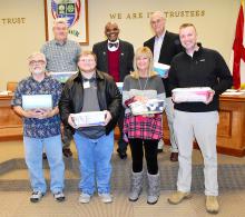 Shown are shoeboxes for “Operation Christmas Child” that were presented for shipment at the Nov. 13 Fayette City Council meeting. Shown from left, front: Fayette Area Chamber of Commerce Director Daniel White, Operation Christmas Child volunteer Jesse Griffin (holding a box donated by Mayor Ray Nelson), Councilwoman Linda McCraw and Councilman Jason Cowart. Back: Councilmen Jerry Nichols, Cedric Wilson and Eddy Campbell.