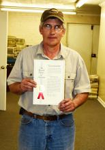 Pictured is Jody Randolph as he holds a copy of the U.S. Patent that he received for his “KwikLock” invention. Randolph received the patent in May 2018.