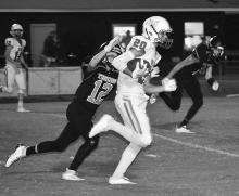 Tyler Lollar (20) is shown running for a big gain for Berry.