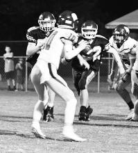  Xander Morrow (88) and Dawson Youngblood are shown pressuring the Waterloo quarterback.