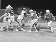 Trent Smith (3) carries the ball for Berry as Matthew Morrison (54) and Houston Cannon (56) block.