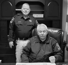 Pictured are incoming Winston Co. Sheriff Horace Moore (standing) and Sheriff Tommy Moore.
