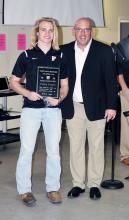 Parker Nichols (left), shown with Head Football Coach Bill Smith, received the “School Record Holder Award” at the football banquet.