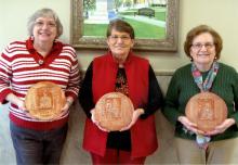 Shown with their service awards, from left: Rosemary Blakney, Revenue Commissioner Ruby Porter and Delorous Gibson.