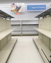 This picture of completely empty paper goods shelves in a local store was typical this past weekend as panicked buyers rushed to stock up on supplies in case of a home quarantine.