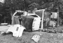 This 2005 GMC C6500 overturned on Highway 107, blocking the roadway.