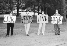 Shown are staff members of the facility, telling the residents that they are their heroes. Many signs seen during the parade praised the workers as the real heroes for taking care of the residents.
