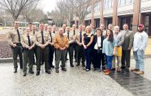 Pictured are many of the conservation officers and law officers, along with members of Jimmy Hutto’s family and District Attorney Andy Hamlin, who attended the pardon and parole hearing for convicted killer David Mosher on Jan. 31. Mosher’s appeal was denied.
