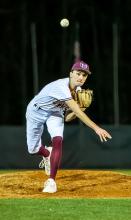 Cade Fisher is shown pitching for Hubbertville.
