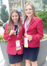 Danni Kate Naramore and Alex Wilson display their FCCLA gold medals.