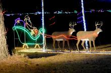 Santa and his reindeer is one of the many scenes that greet visitors during “Christmas at the Park”