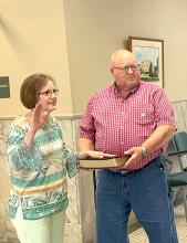 Jeananne Edwards, pictured left, is shown with her husband David Edwards as she was sworn in as Fayette County Revenue Commissioner on Tuesday, Sept 2.