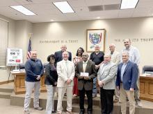 Fayette Medical Center (FMC) Hospital Board Members were on hand to receive a check in the amount of $424,307.98 from the city council for upgrades to FMC. Pictured from left to right on the back row are council members Tommy Williams, Aliska Hughes-Monroe, Jerry Nichols, Eddy Campbell and Steve Herring; front row are FMC Board Members Heath Reed, Rhonda Hicks, Jason Nelson, Hospital Board Chairman Charles Brandon, FMC Administrator Rodney Clark and Mayor Rod Northam.