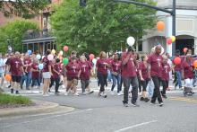 Marchers head north down Temple Ave. toward the courthouse where they will release their balloons and walk on to Fayette First Baptist Church.  
