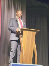 Junior Mayor Sean White addresses the audience at the beginning of the Superintendent of Education Forum on April 27.