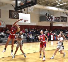 Berry’s Maggie Mauldin (14) leaps for a basket | Photo by Kelly Bonner