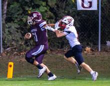 Hub’s Bryce Afshar (61) carries the ball in for a touchdown. | Photo by Leah Hollingsworth