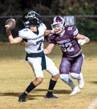 Hub’s Braylon Hill (52) puts pressure on the Panthers’ quarterback. | Photo by Leah Hollingsworth
